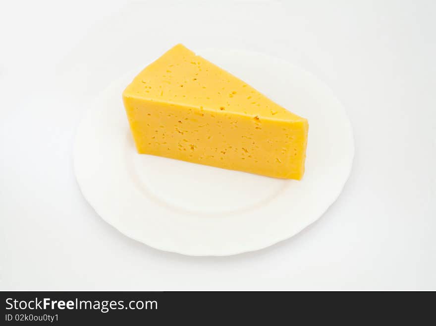 An image of a piece of yellow cheese