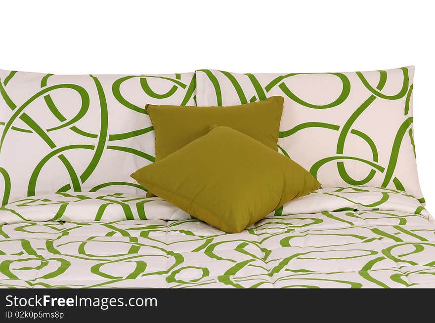 Green and white bed spreads with soft pillows. Green and white bed spreads with soft pillows.