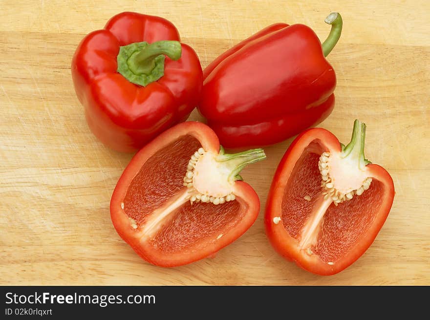 Red Peppers on a cutting board