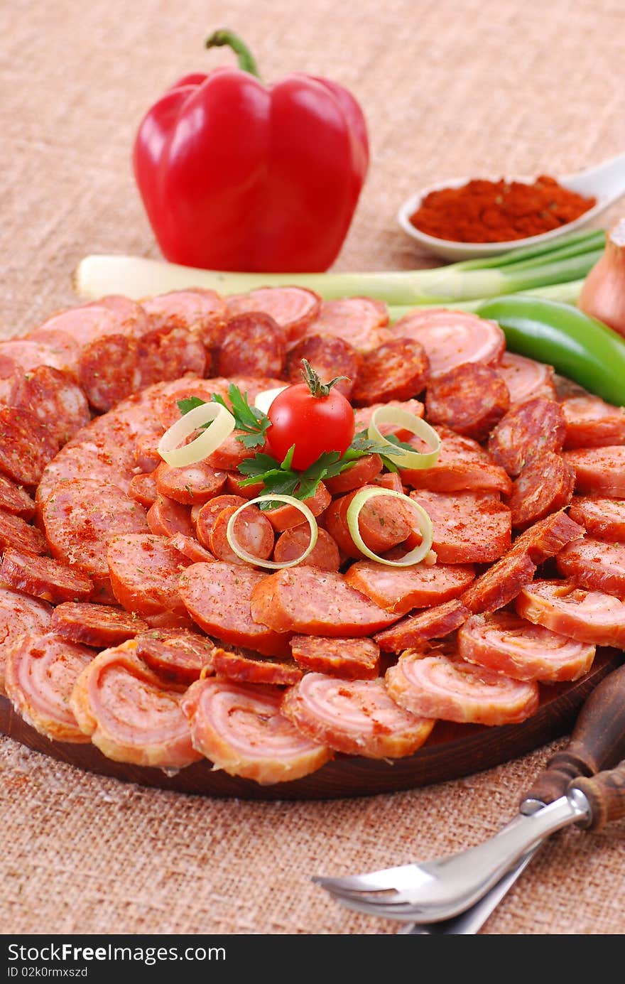 Plate of various sausages with vegetables