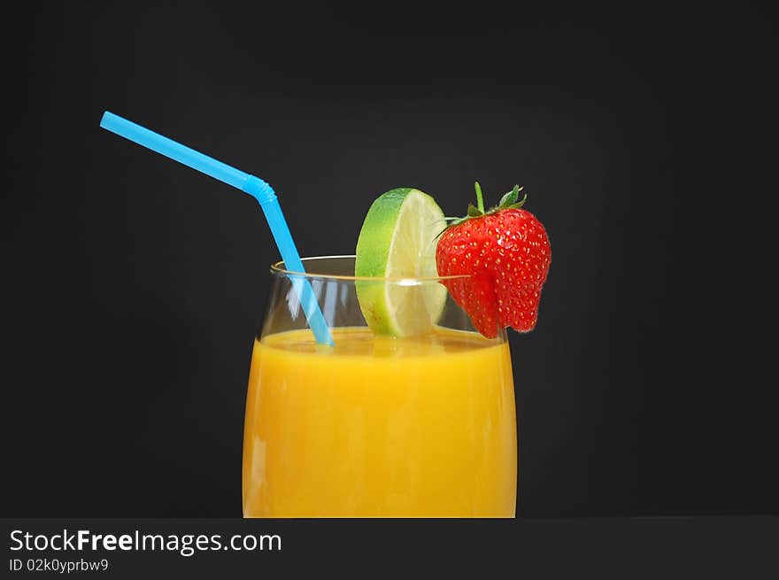 Mango smoothi in a glass with a straw. Mango smoothi in a glass with a straw