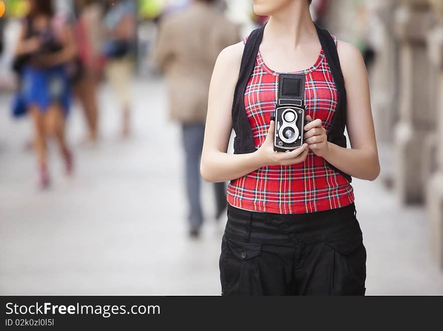 Young urban unrecognizable vintage photographer with old 6x6 camera. Young urban unrecognizable vintage photographer with old 6x6 camera.