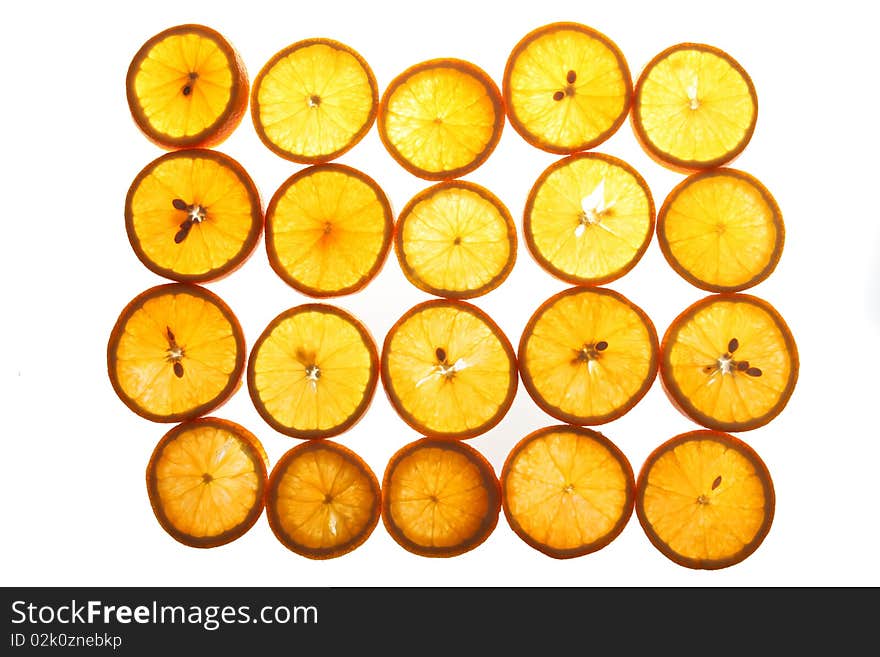 Cut segments of an orange on a white background. Cut segments of an orange on a white background.