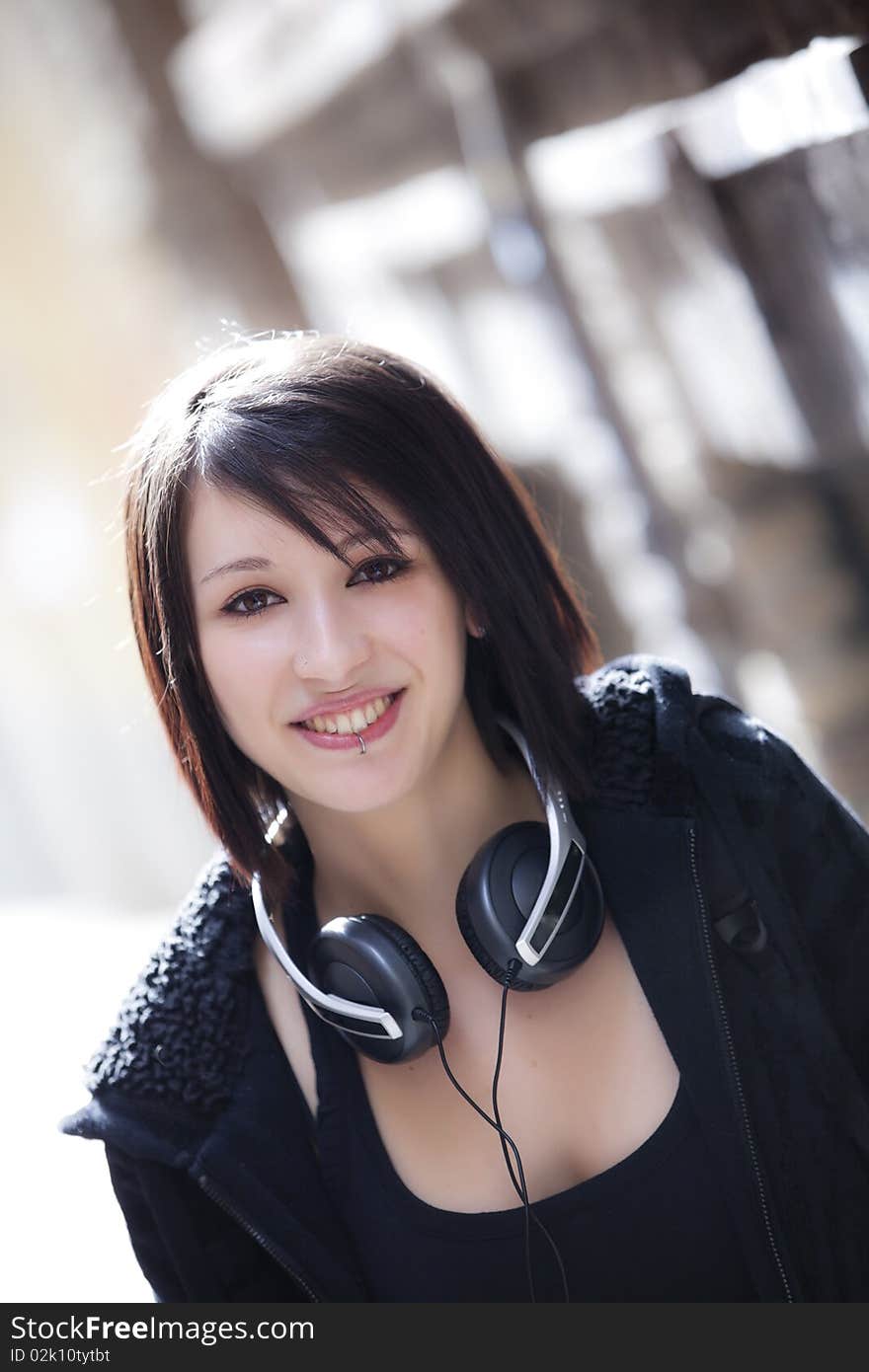 Young beautiful urban girl smiling at camera. Young beautiful urban girl smiling at camera.