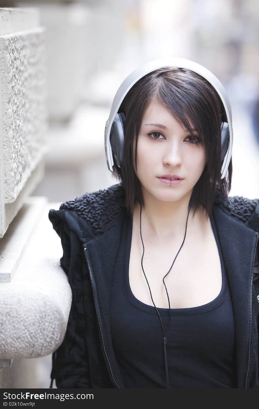 Young beautiful pierced girl with headphones. Young beautiful pierced girl with headphones.