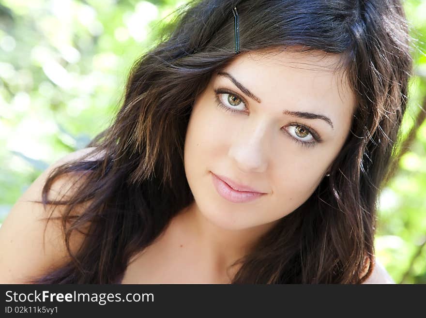 Beautiful woman with impressive green eyes staring at camera. Beautiful woman with impressive green eyes staring at camera.