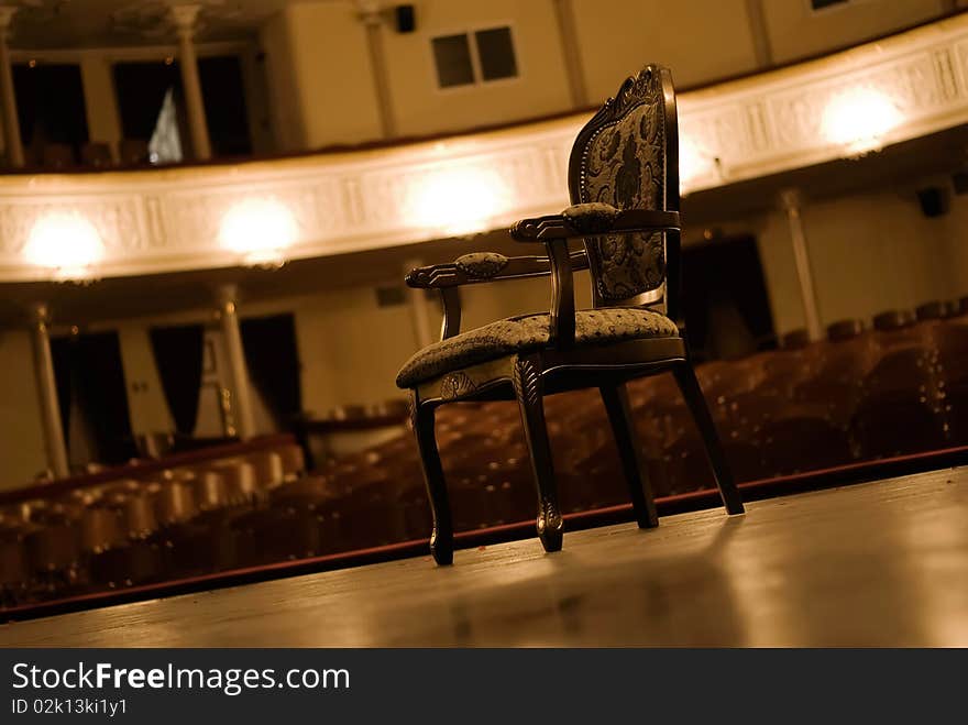 Armchair on a stage.