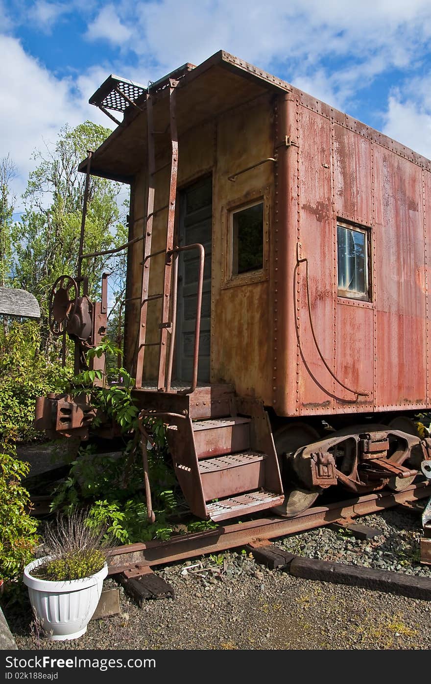 An old red caboose converted into a home