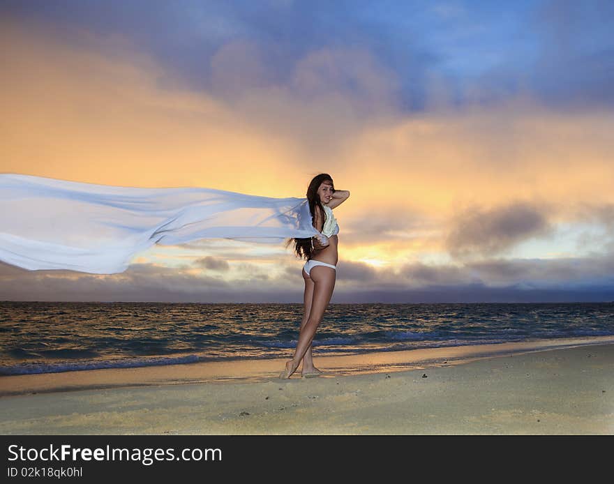 Woman on lanikai beach at sunrise