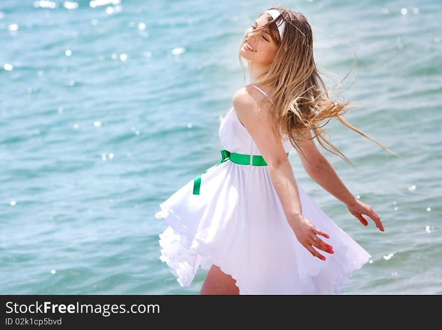 Happy girl on sea background