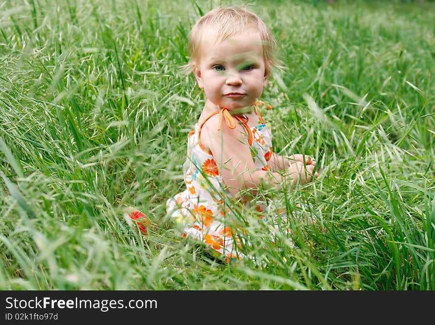 Toddler girl in green grass