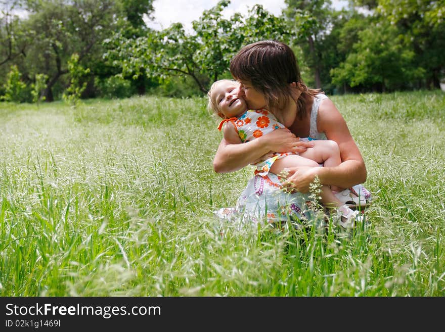 Mother and daughter on natural background