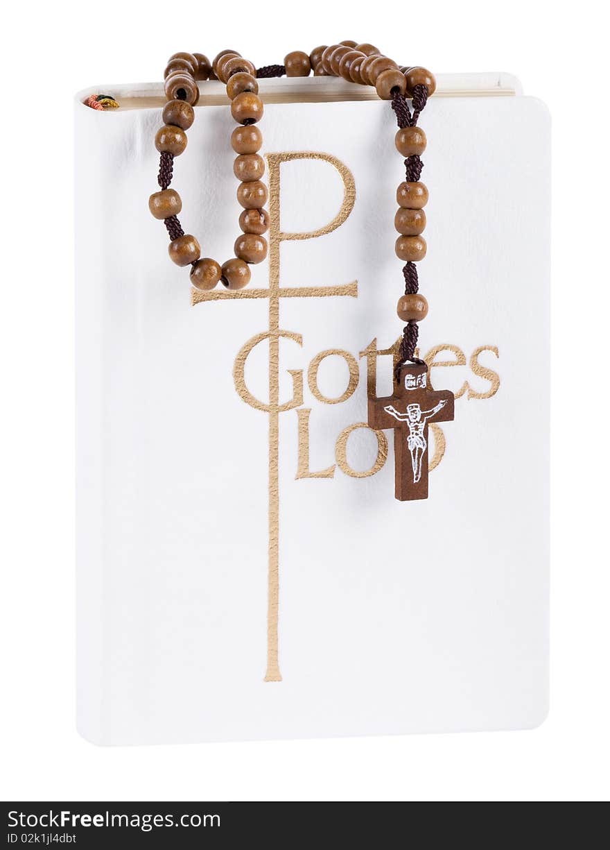 Bible with rosary in front of white background