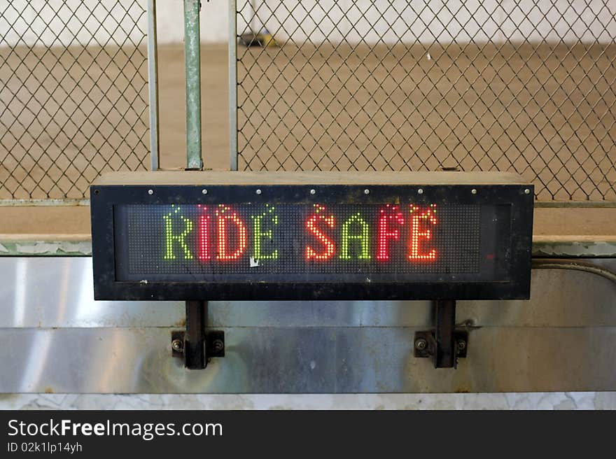 RIDE SAFE sign at a grungy looking subway entrance