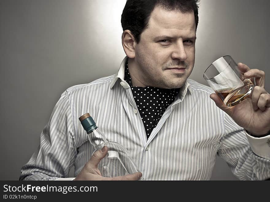 Handsome Man With A Glass Of Cognac