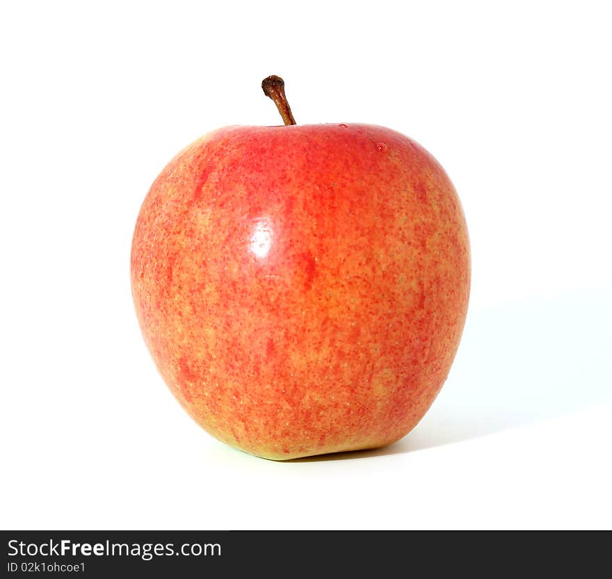 Single red apple with shadow isolated over white