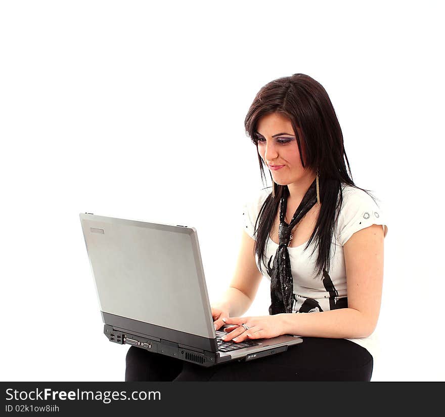 Girl working on a laptop isolated on white background