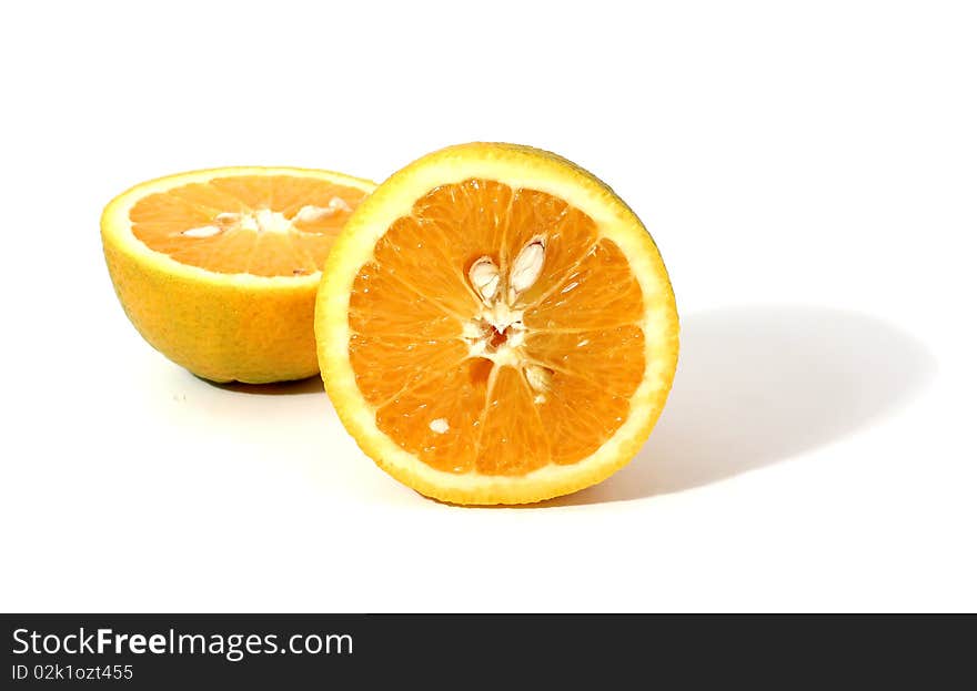 Two pieces of orange with shadow isolated over white