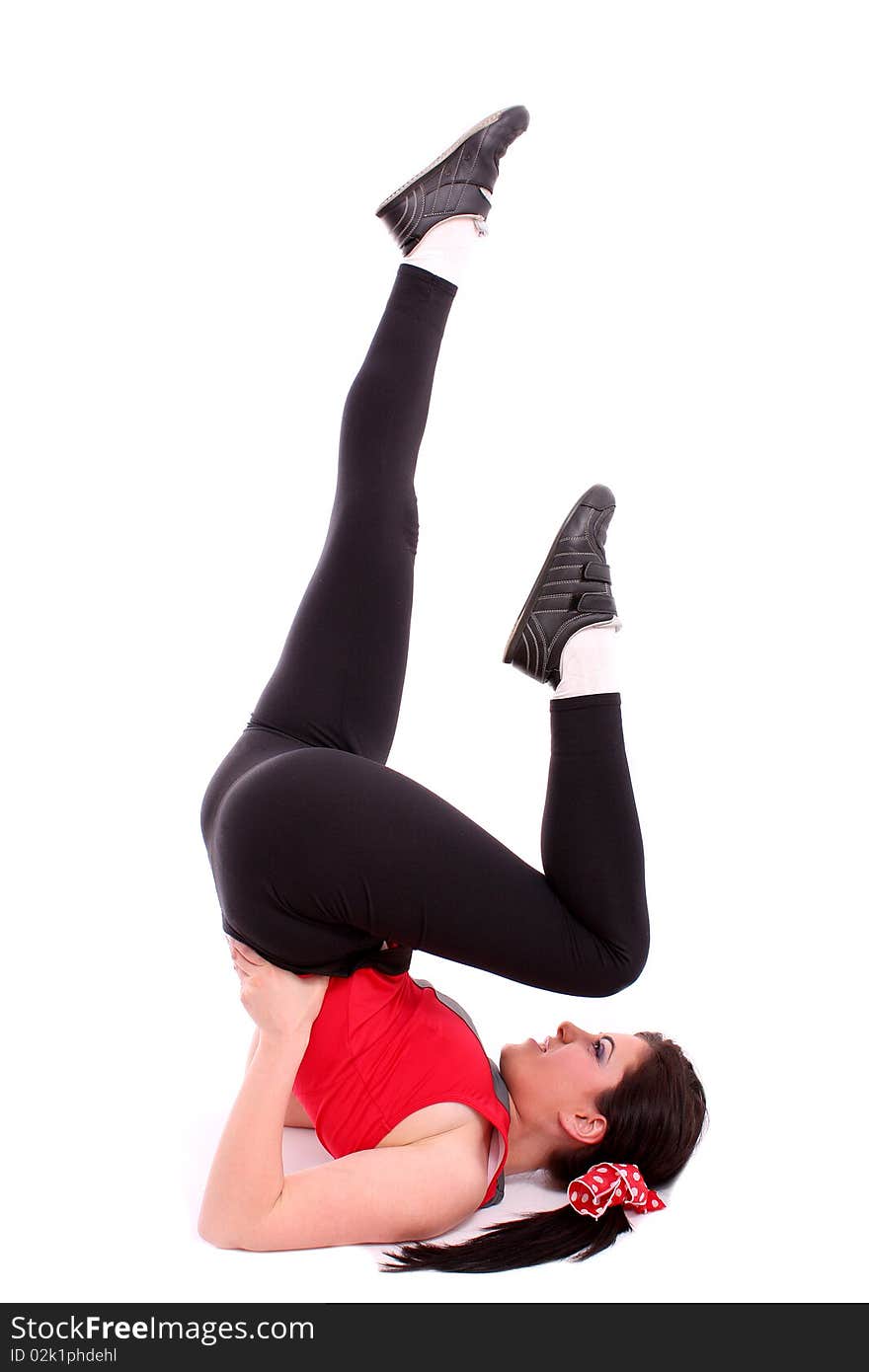 Pretty young girl in the gymnastic pose