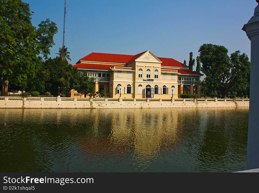 Refection of castle on water in old grand palace of King Rama the fifth in Thailand