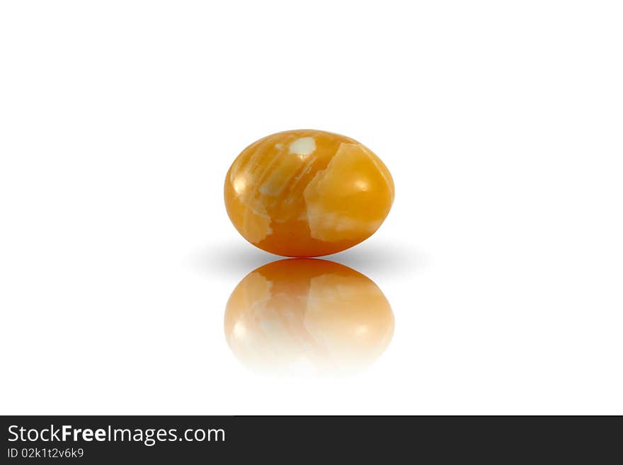 Lying yellow egg on white background