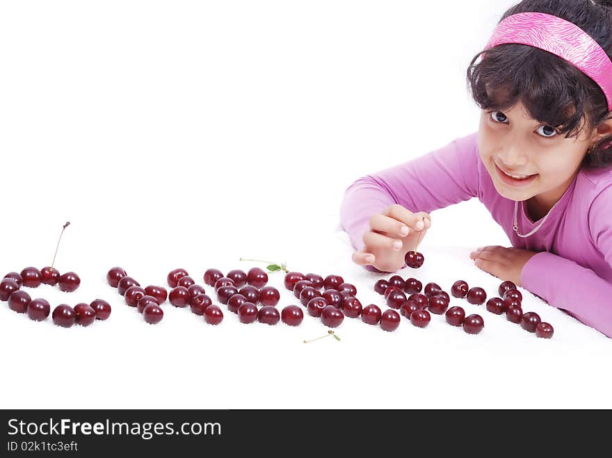 Beautiful little kid with cherry