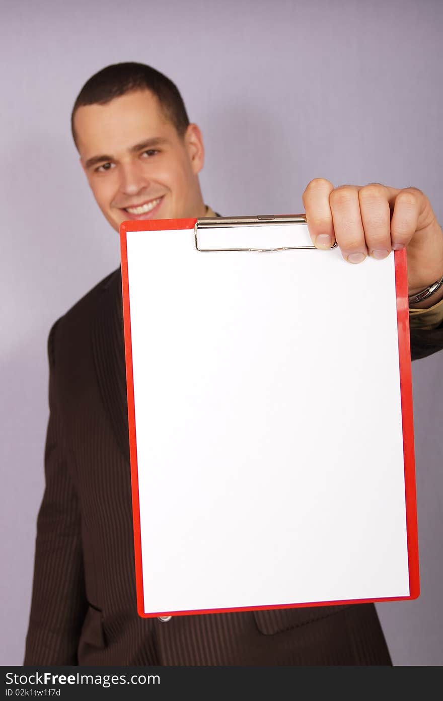 Young businessman with paper