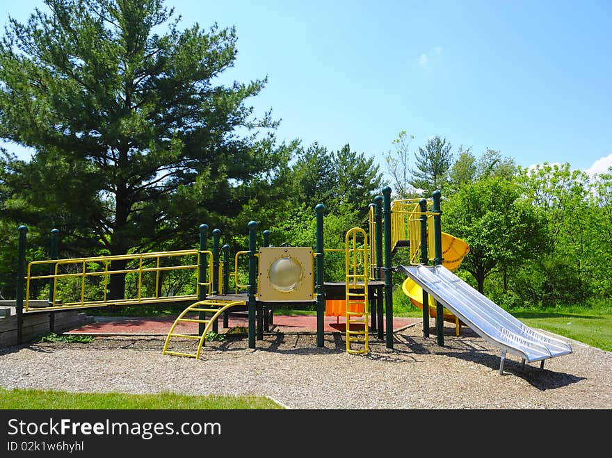 Yellow and green playground with slide