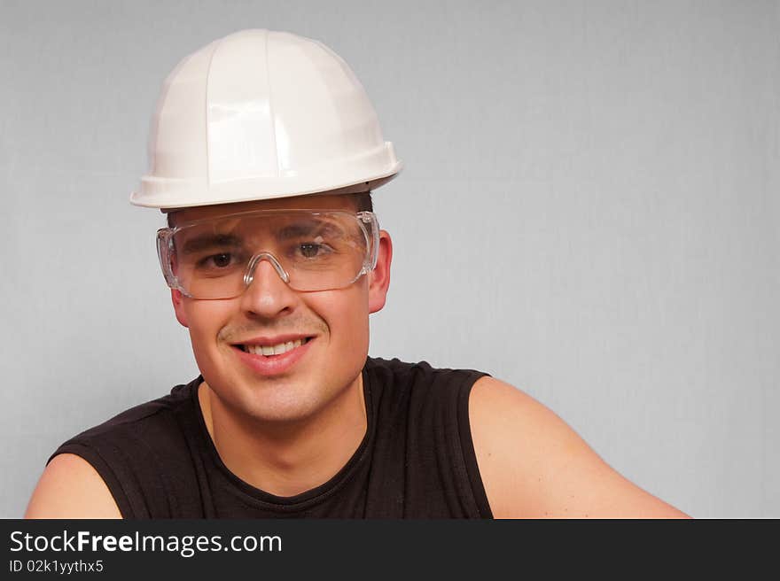 Portrait Young Man In A Protective Helmet