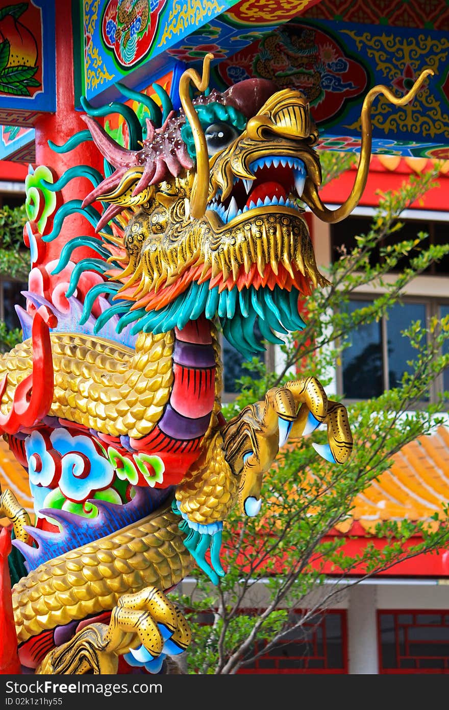 Golden dragon decorate on the pole of spirit ritual hose of Chinese in Thailand