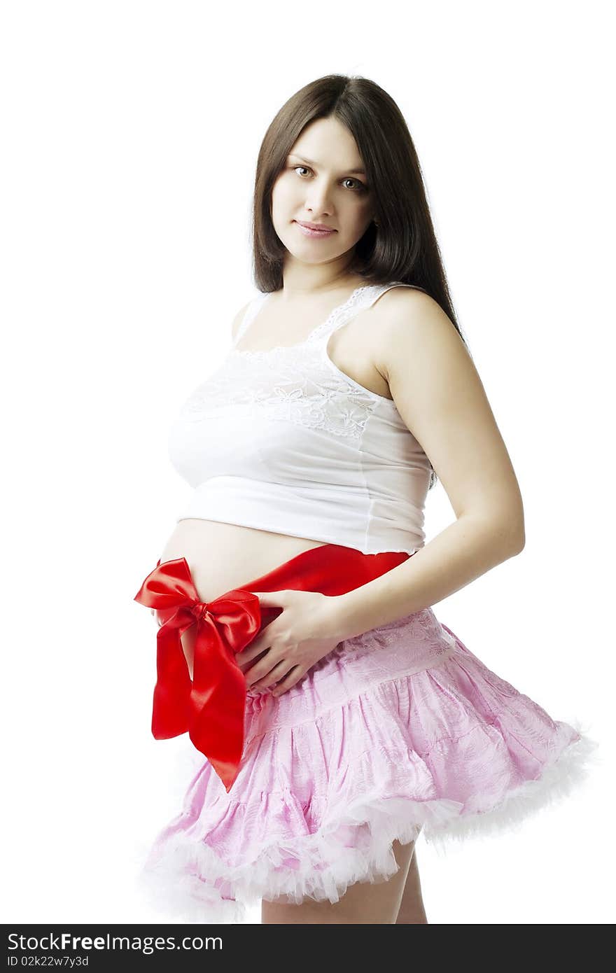 Pregnant woman with a red bow on her stomach