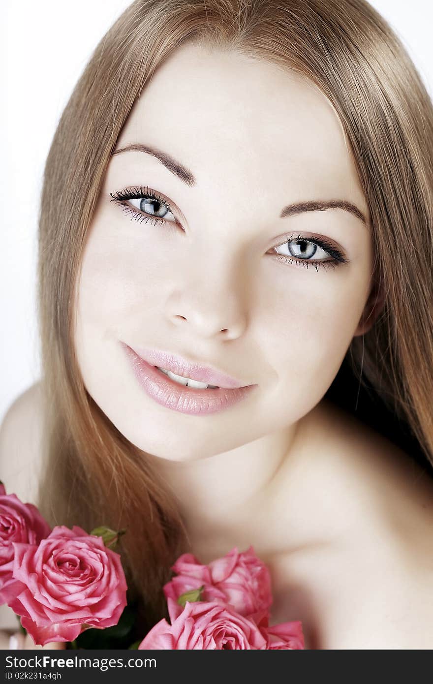 Beautiful girl on a white background with roses