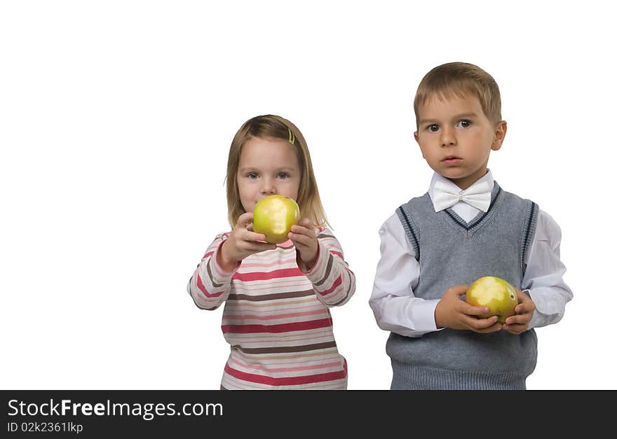 Pretty Boy and beautiful girl is eating big yellow apples. Pretty Boy and beautiful girl is eating big yellow apples