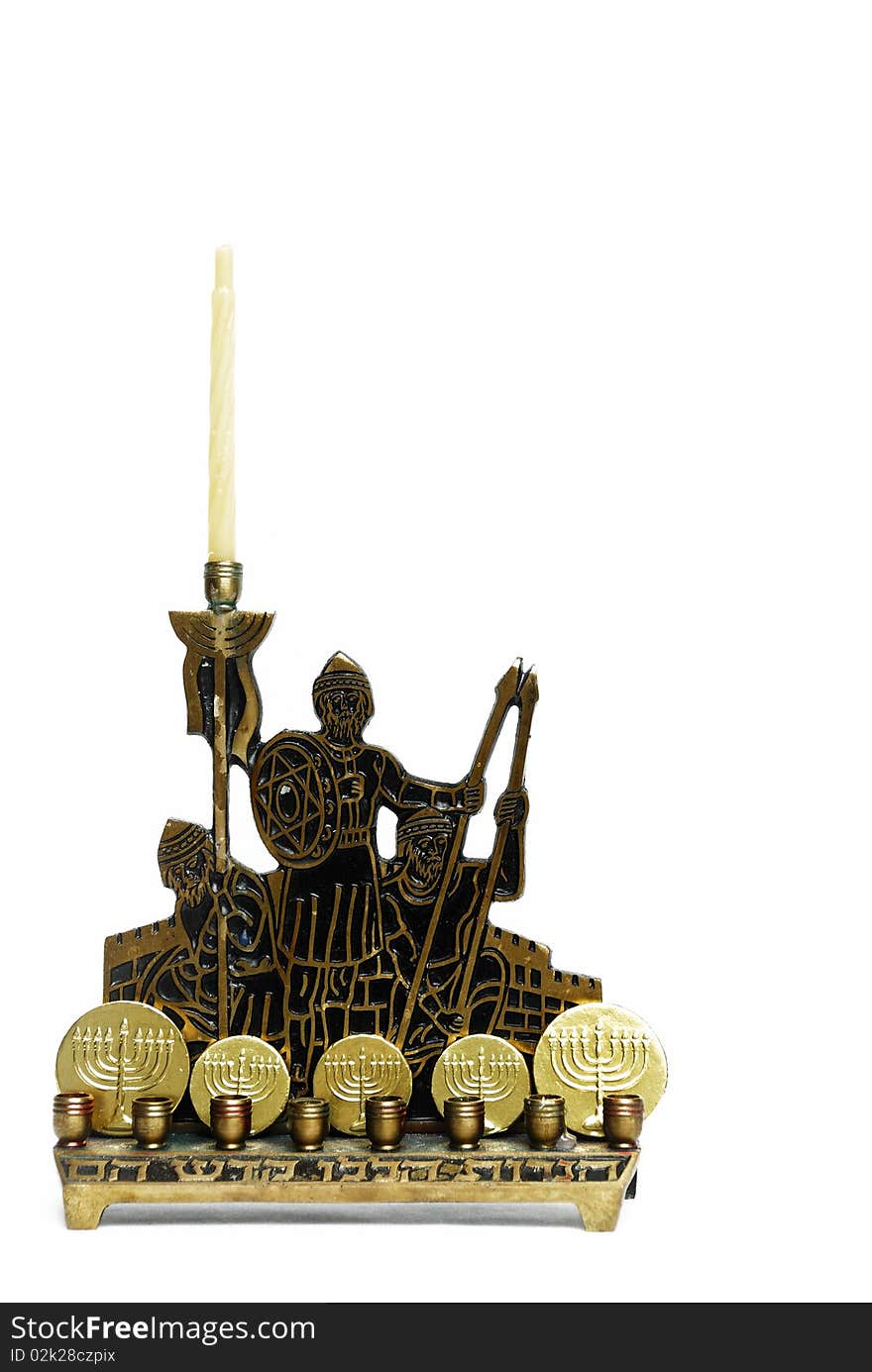 Brass and black menorah with gold covered chocolate coins. Brass and black menorah with gold covered chocolate coins