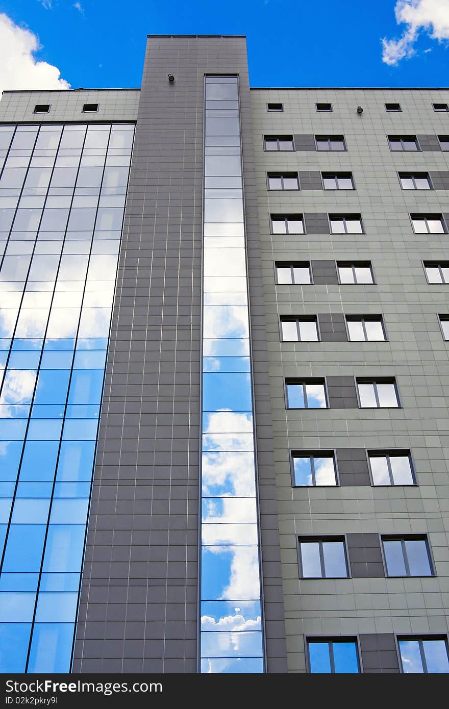 Facade of modern office building on a background of the blue sky