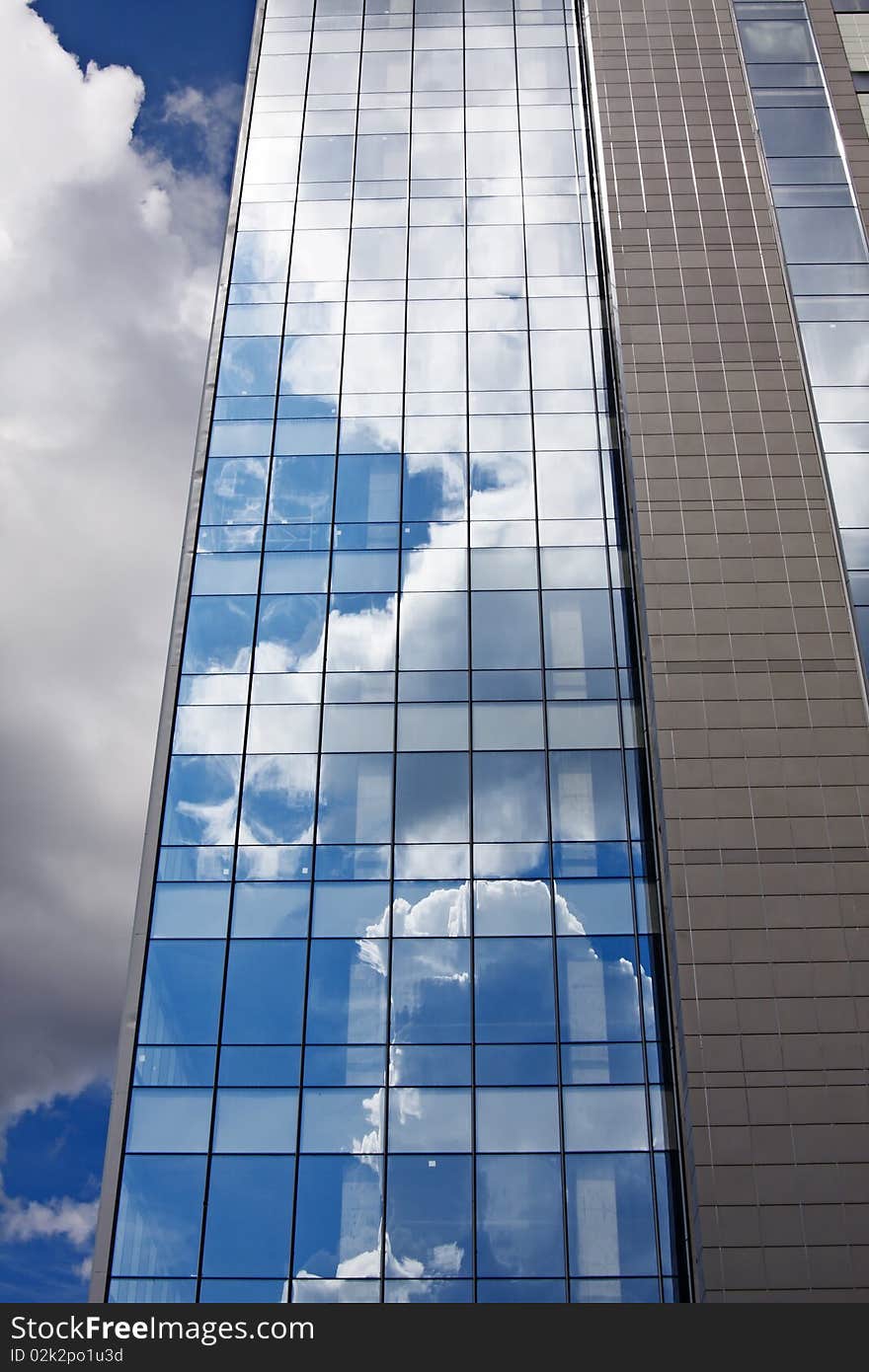 Facade of modern office building on a background of the blue sky