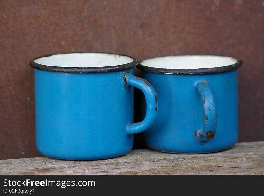 two old and rusty mugs