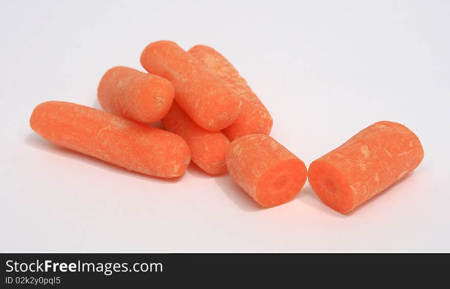 Baby carrots on white backgroun