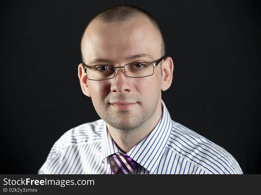 Portrait of businessman on a black background. Portrait of businessman on a black background