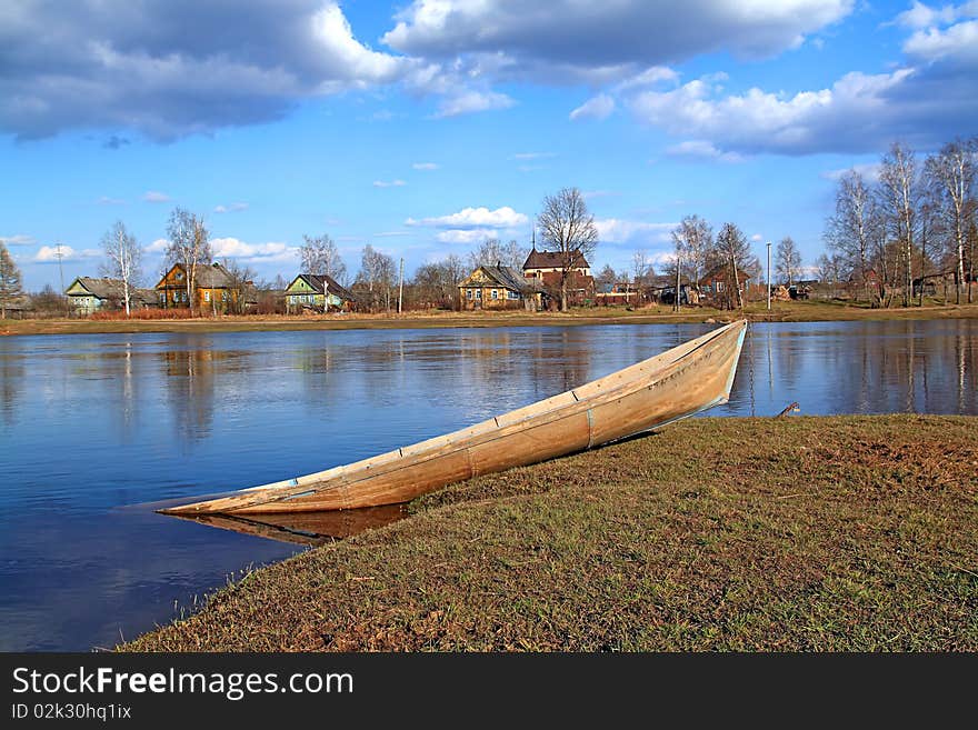 Aging boat in river near villages. Aging boat in river near villages