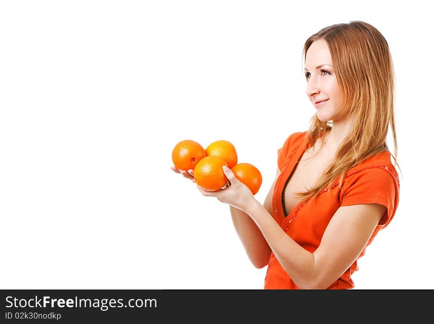 Portrait of a young pretty girl in dress which holds oranges. Isolated on white. Portrait of a young pretty girl in dress which holds oranges. Isolated on white.