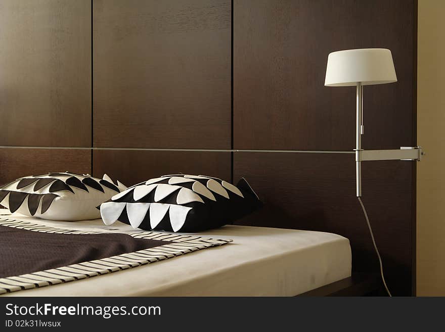 A part of bedroom in brown colors