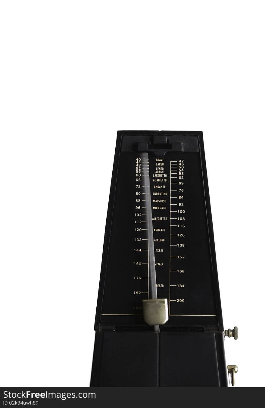 Black metronome on white background with meter blurred in movement. Black metronome on white background with meter blurred in movement