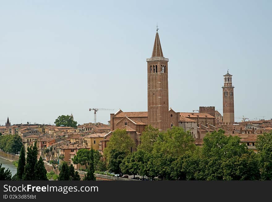 The basilica of sant  anastasia 
 and buildings in verona in italy. The basilica of sant  anastasia 
 and buildings in verona in italy