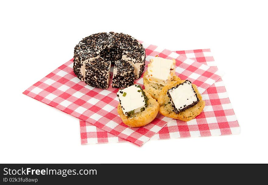 Cheese with toast on a checkered napkin isolated on a white background