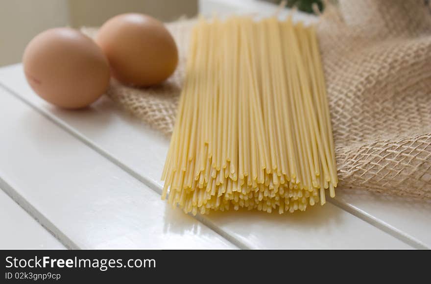 Pasta and egg on the natural sackcloth. Pasta and egg on the natural sackcloth