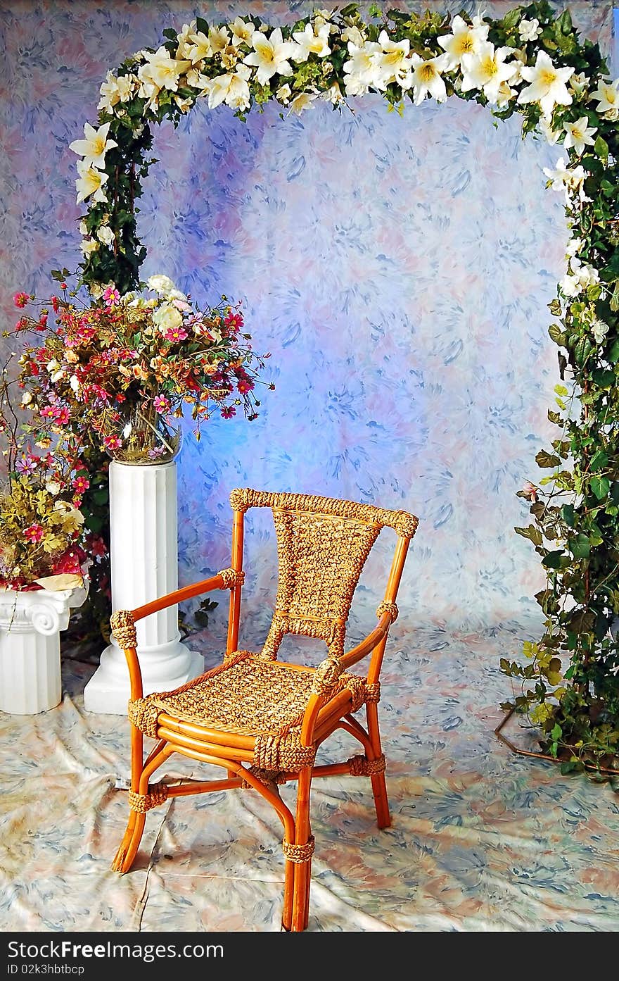 Wooden arm-chair and decorative pattern of flowers