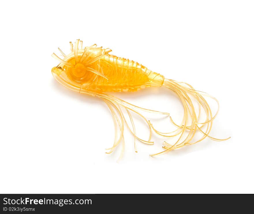 Small toy goldfish isolated on white background