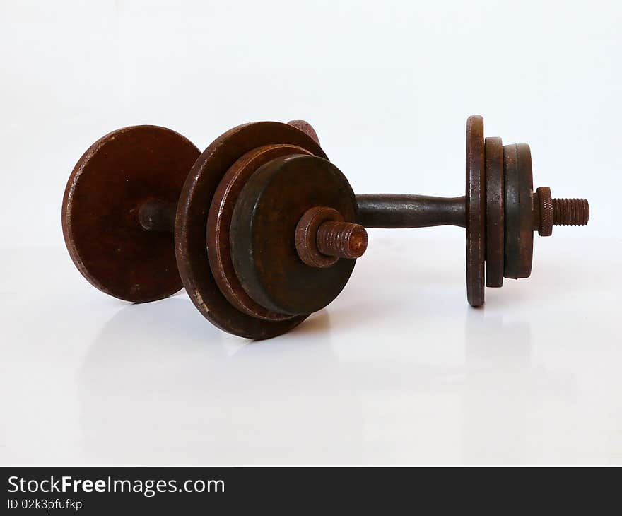 Rusty dumbbells on a white background