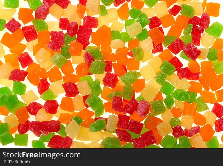 Diced pineapple on white background. Candied fruits.